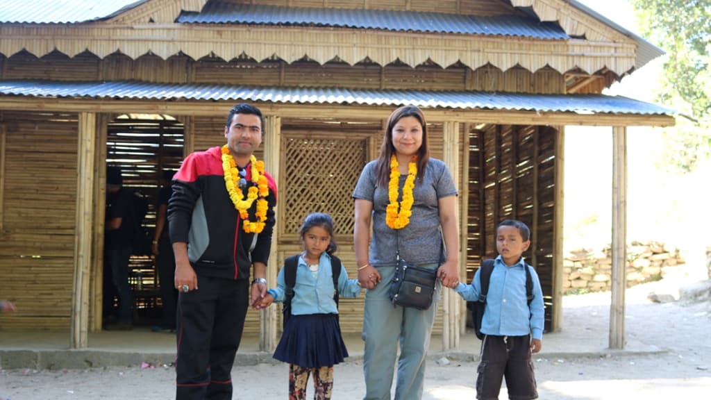 Praramva representatives with schoolchildren at the handover of the rebuilt Bamboo School in Lagarche, Sindhupalchok.