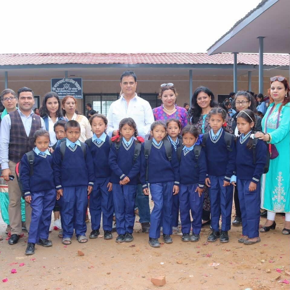 Praramva representatives with schoolchildren